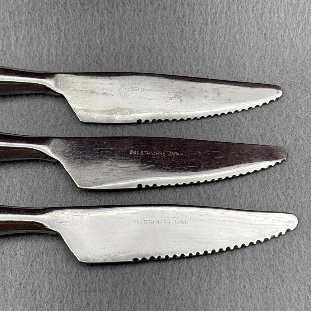 SSI Stainless Japan Black Canoe Style Resin Handle Serrated Edge Dinner Knife 6‎